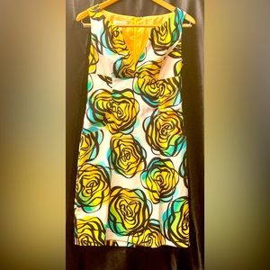 Flora dress good for any semi formal occasion. Knee length. Figure flattering.